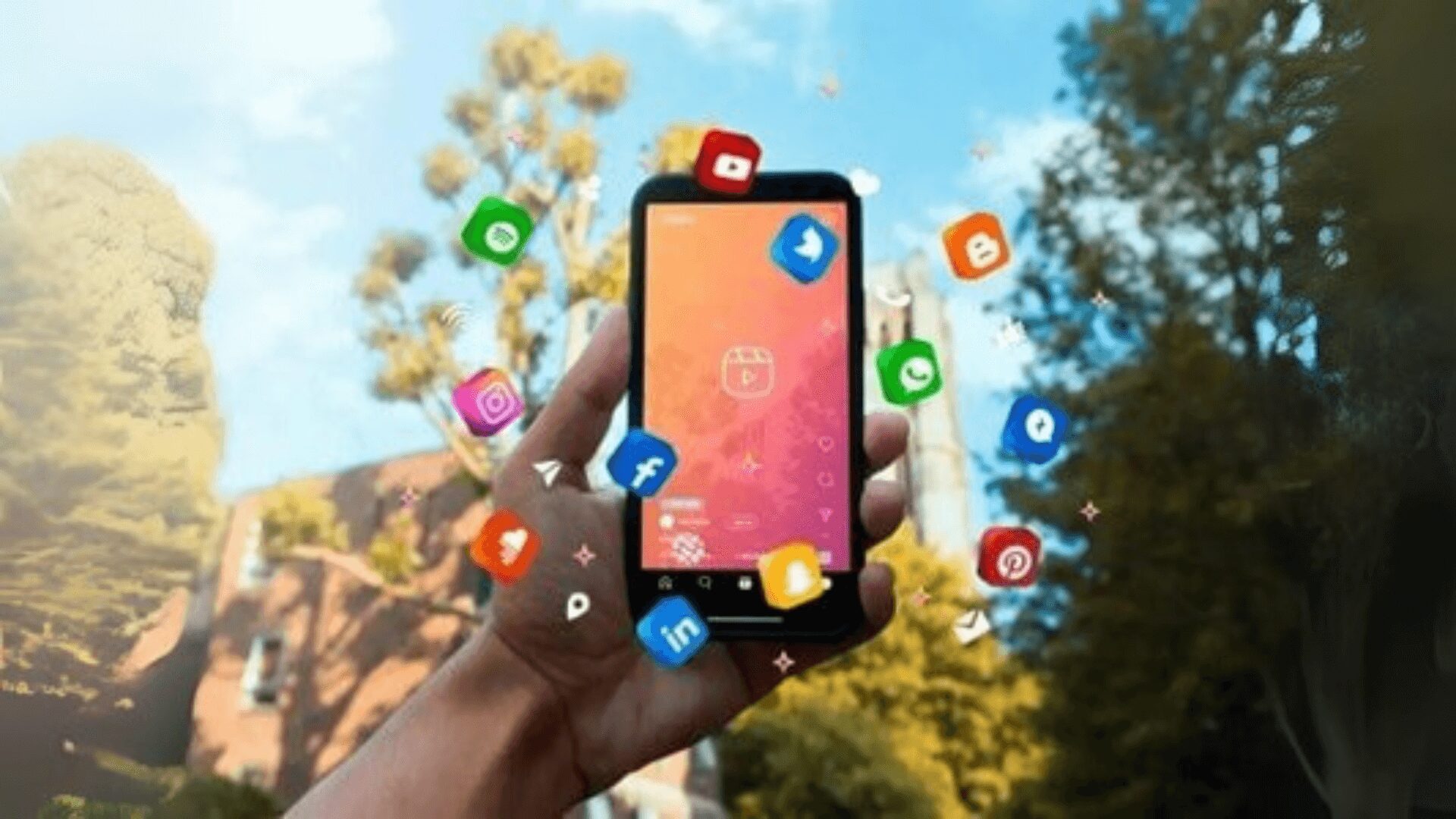 Imagem destaca tendências de social media para indústrias em 2025, mostrando um smartphone com ícones de redes sociais flutuantes ao seu redor. 